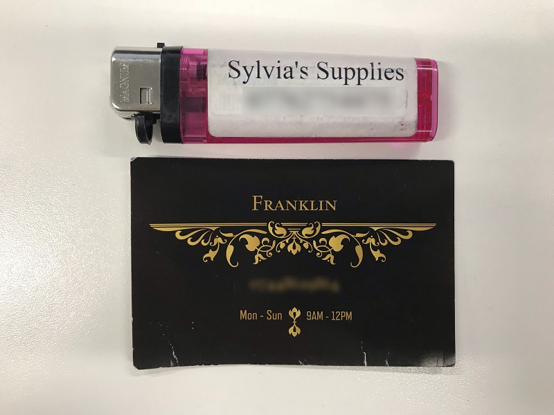 Lighter for 'Sylvia's Supplies' and business card by 'Franklin'